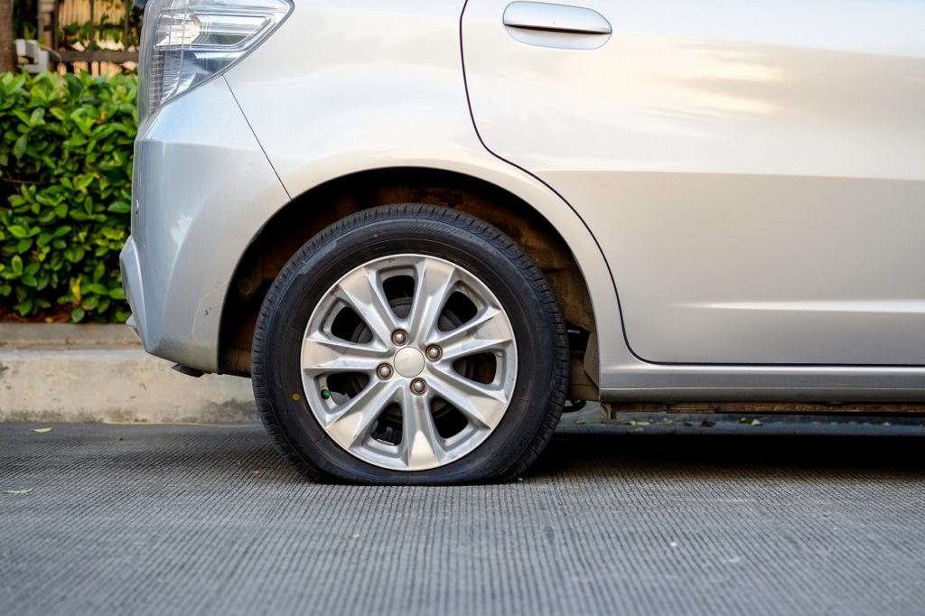 Small Compact Car Needs Flat Tire Service